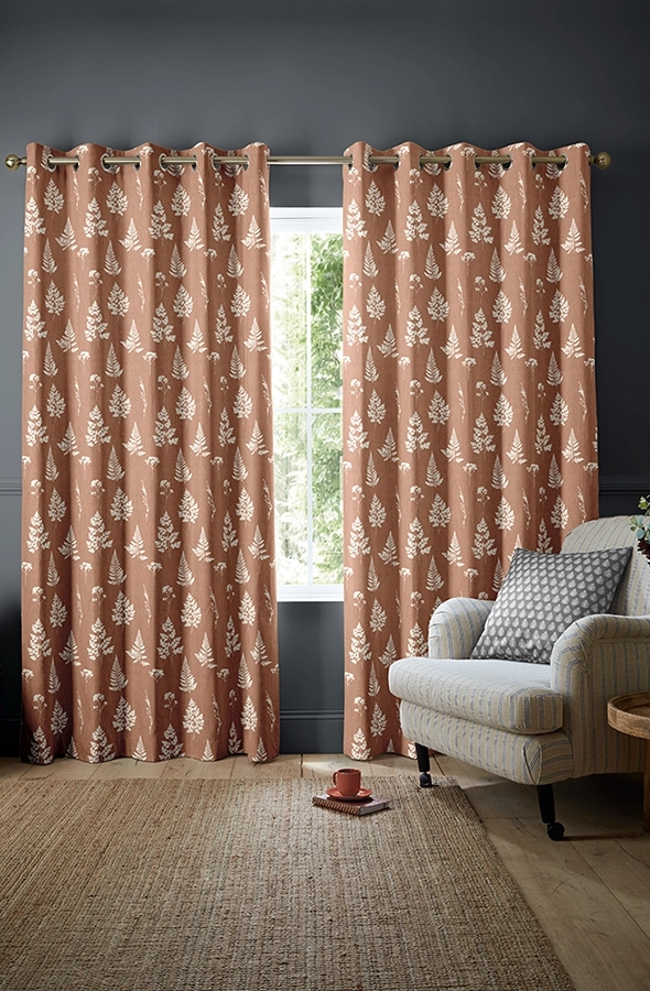 Room with plant design brown curtains form Emily Bond
