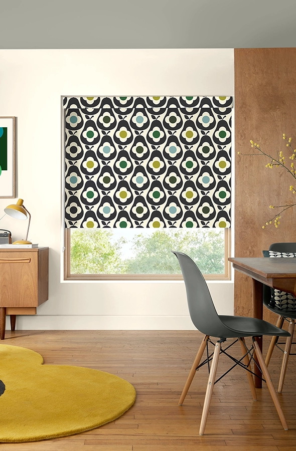 Room with purple fruit design roller blind from Orla Kiely