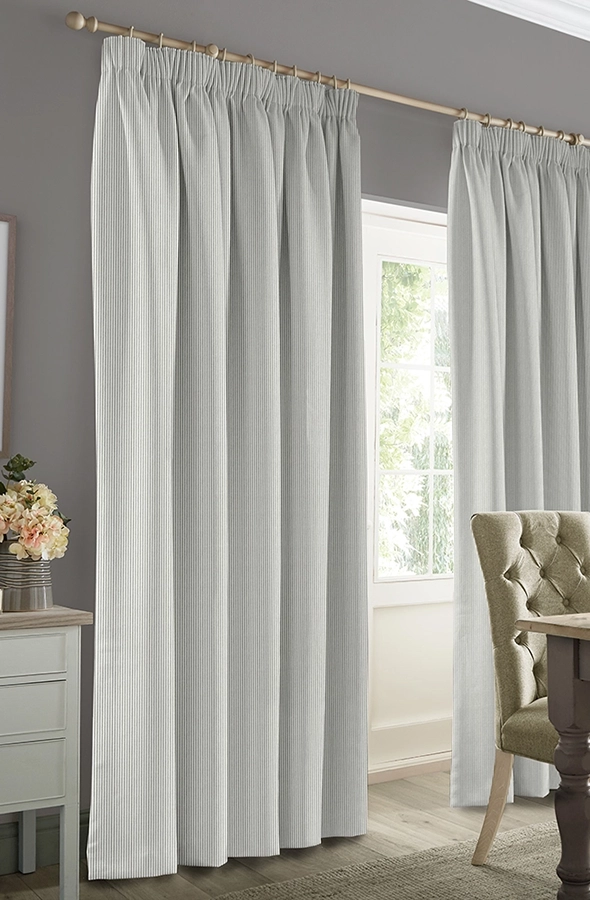 Room with grey stripe design curtains form Sophie Allport