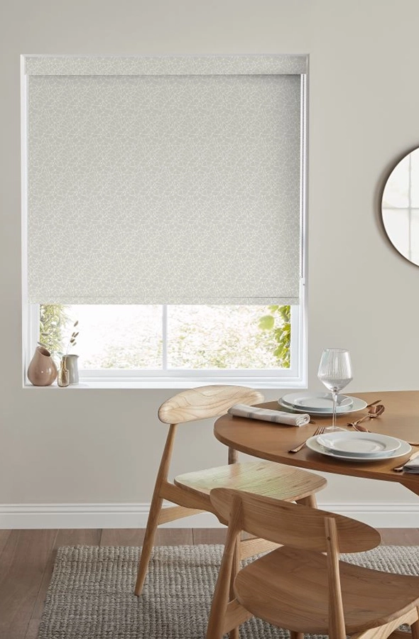 Room with silver roller blind from illumin8 Rollers Collection