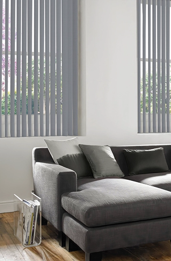 Room with light blue vertical blind form illumin8 Edit Verticals Collection