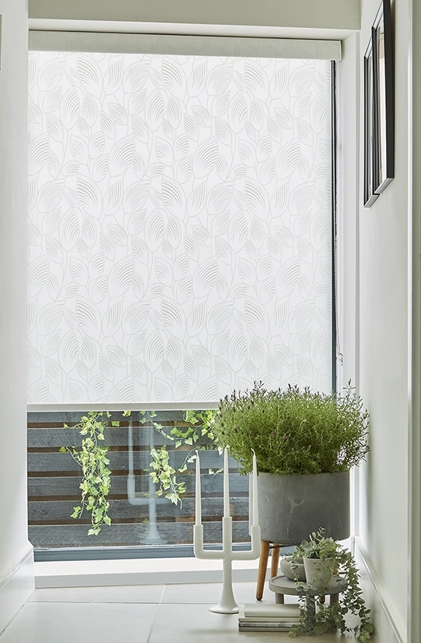 Room with white geometric design roller blind from illumin8 Simply™ Roller Collection