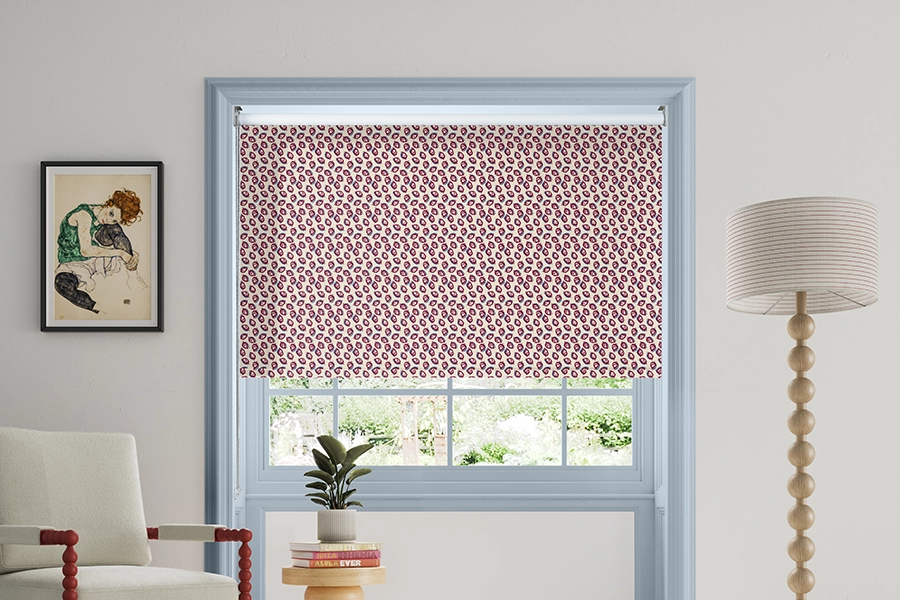 Room with red geometric roller blind from Land & Shore