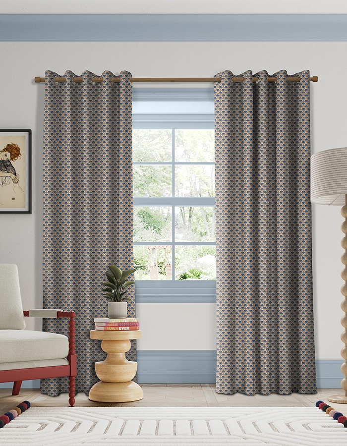 Room with blue and red geometric curtains from Land & Shore