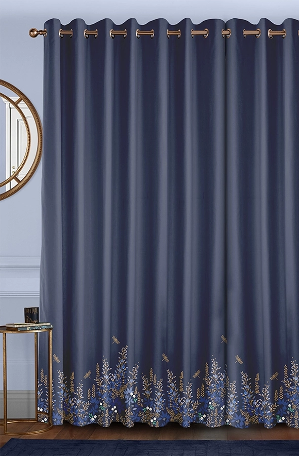 Room with dark teal curtains in floral design from Sara Miller