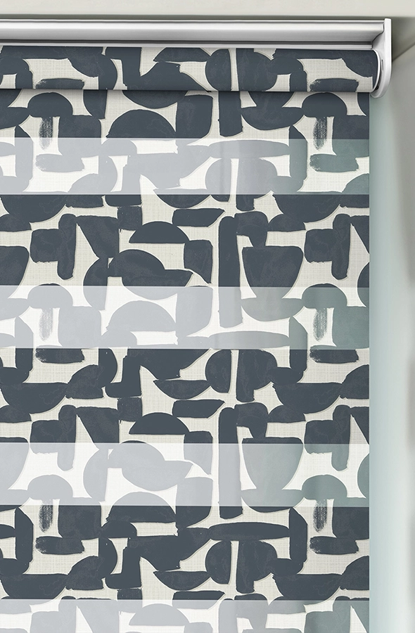 Room with black and cream geometric design day & night blind from illumin8 Edit Fifty50™ Collection