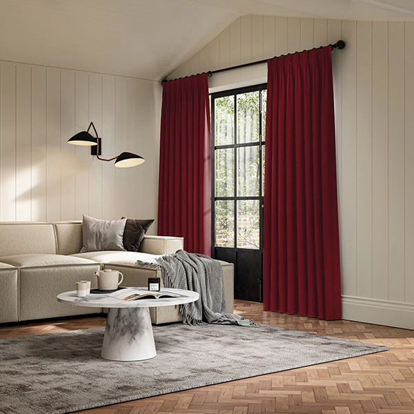 Living room with dark red curtains from illumin8's Loom collection